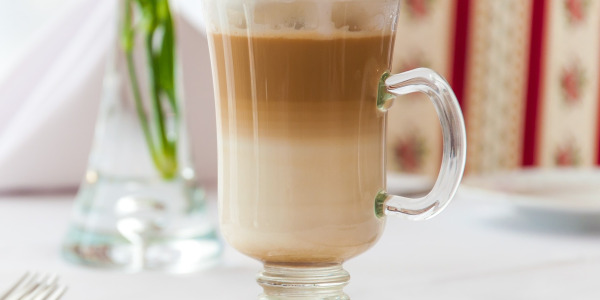 Preparing latte macchiato coffee